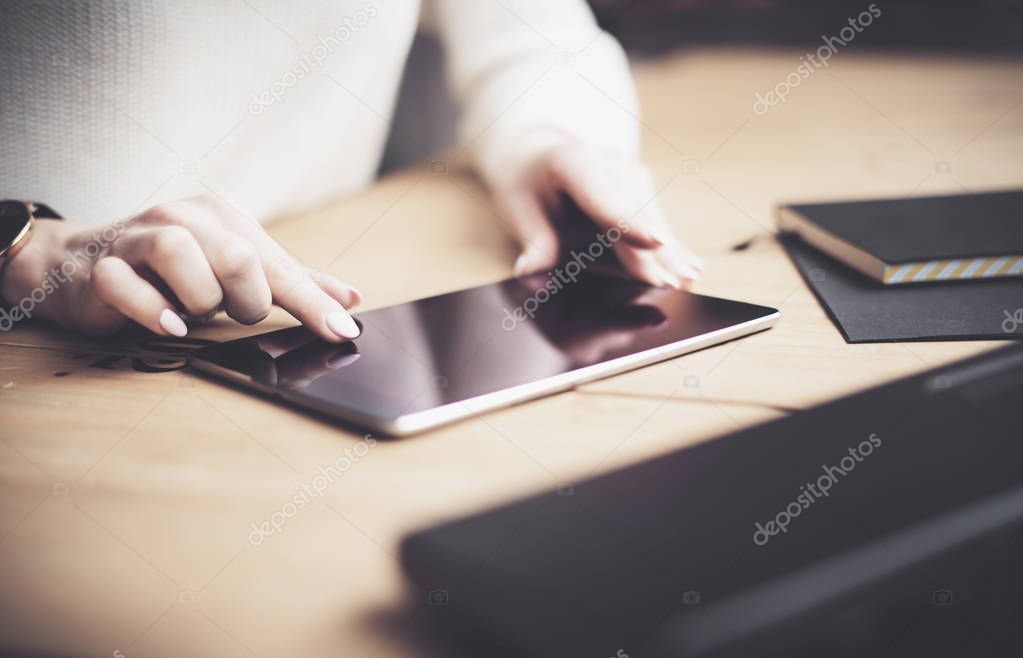 female fingers touching screen