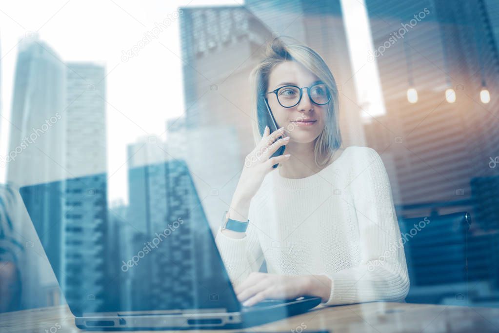 woman using laptop and smartphone