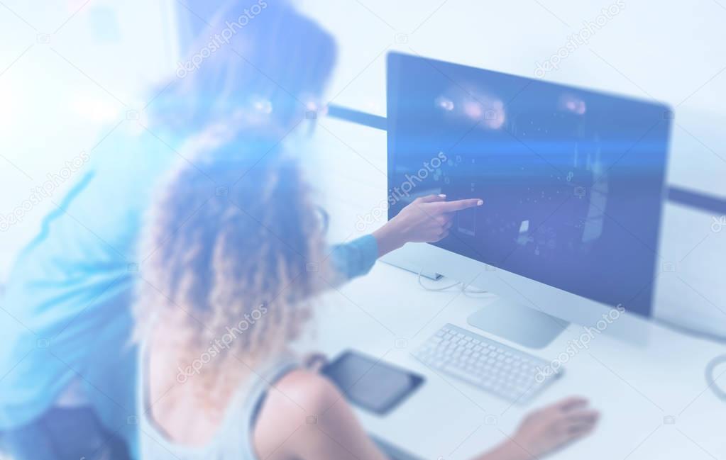 Two women using computer 