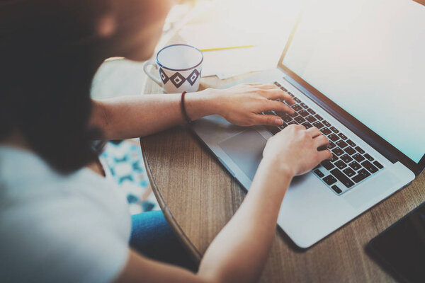 woman typing on laptop