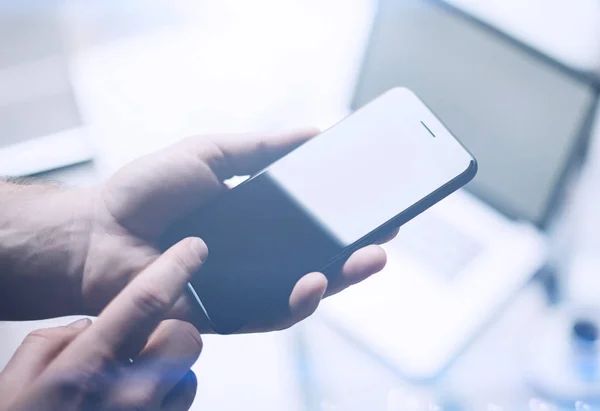 Male hands holding smartphone — Stock Photo, Image