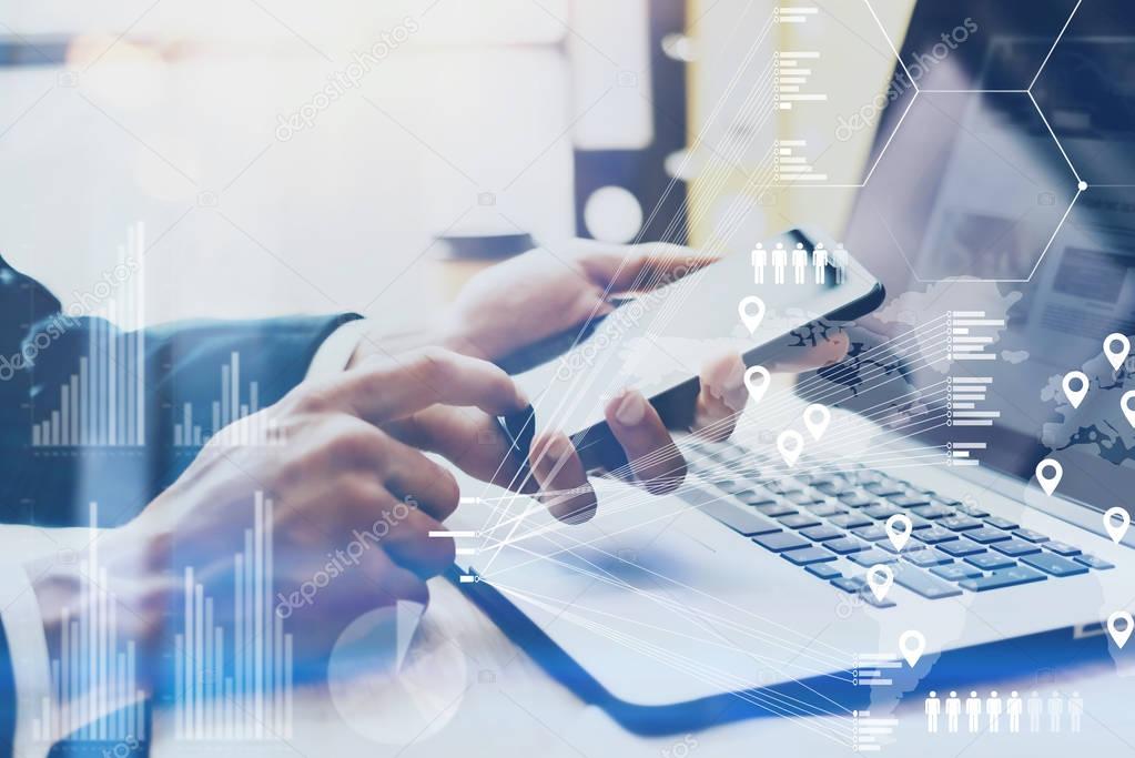 Closeup view of Male hand pointing finger on smartphone touch screen.Businessman working at office on modern notebook.Concept of digital diagram,graph interface,virtual screen,connection icon.Blurred.