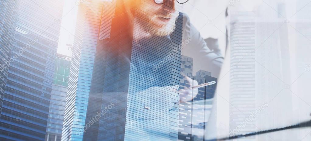 businessman working at office with skyscrapers