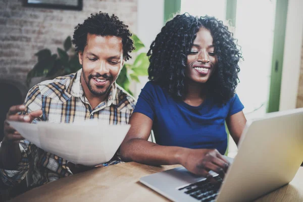 Young couple checking bills — Stock Photo, Image