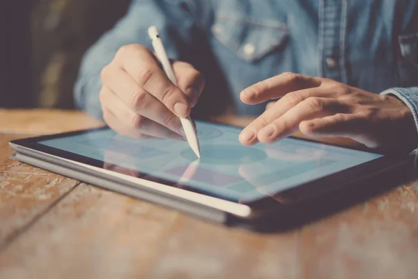 man using electronic pen and tablet