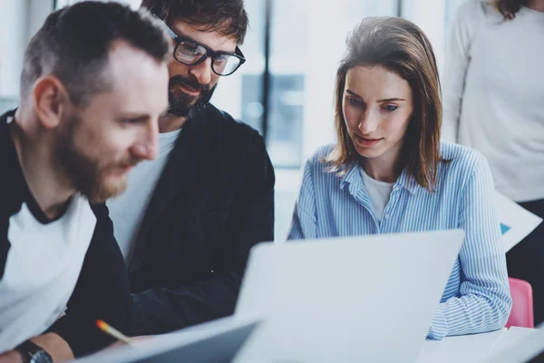 Teamwork process concept.Happy colleorkers working with new startup project at sunny office.Horizontal, blurred background . — стоковое фото