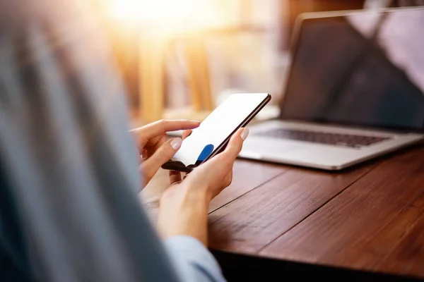 Woman pointing on smartphone screen, chatting in social networks — Stock Photo, Image