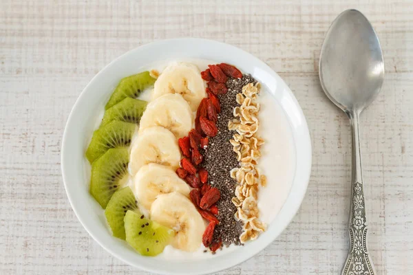 Yogurt with fruits, oats and chia seed — Stock Photo, Image