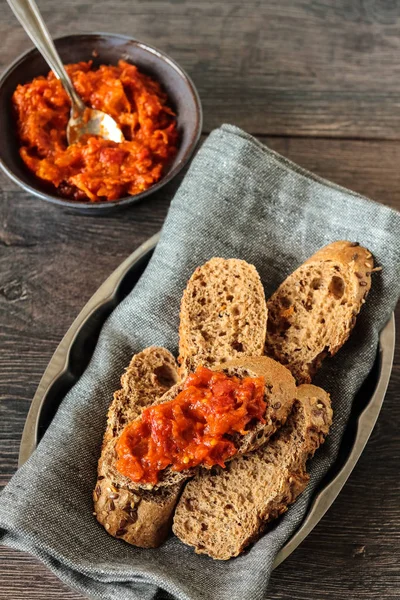Carrot and red bell pepper spread in rustic bowl — Stock Photo, Image