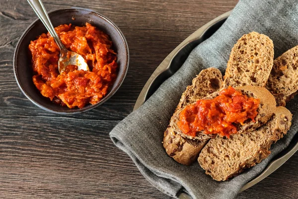 Carrot and red bell pepper spread in rustic bowl — Stock Photo, Image