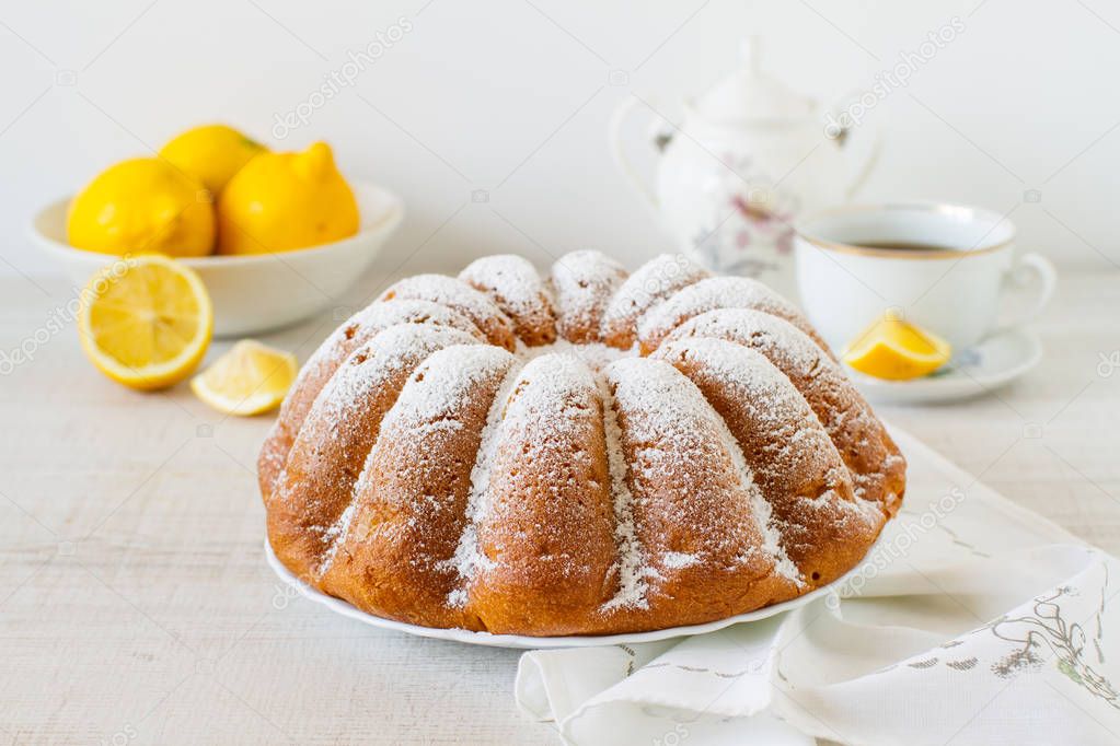 Homemade vanilla cake with lemon close-up on the table