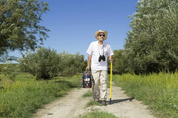 Young adult man tourist on rural road — Stock Photo, Image