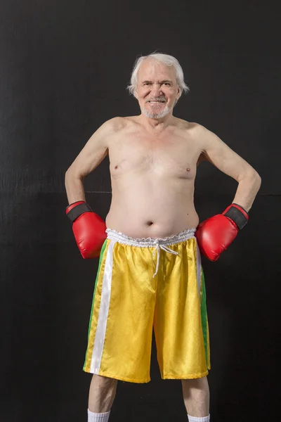 Senior boxer portrait on a dark background — Stock Photo, Image