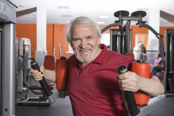 Senior man in fitness center
