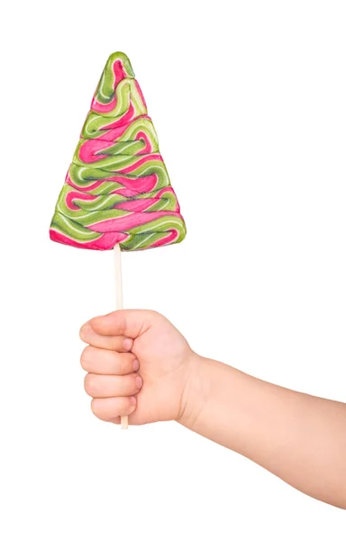Färgglada lollipop i barnets hand — Stockfoto