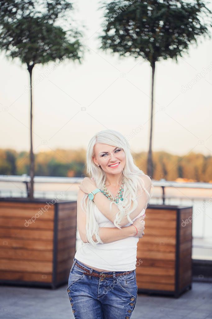 cheerful young woman loves hugging herself