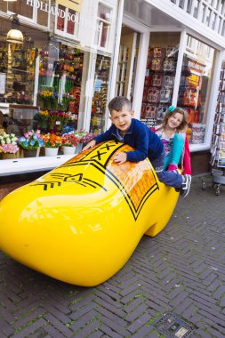 Amsterdam Children sitting in a socket Dutch clipart