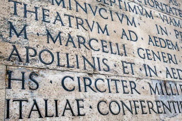 Ancient Latin inscription on the outside wall of Ara Pacis wall in Rome