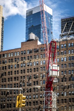 crane in construction site at the center of New York City clipart