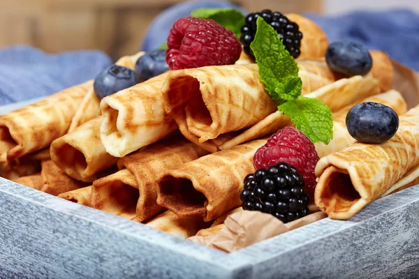 Waffle rolls with berries — Stock Photo, Image