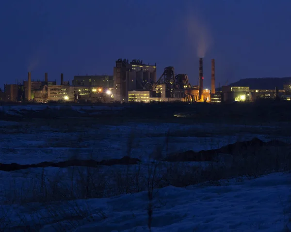 Huge cement plant, industrial plant at night in winter