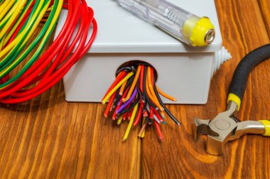 Electrical junction boxs with cables wire and tool used in the electric installation process