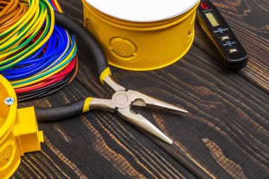 Electrical junction boxs with cables wire and tool used in the electric installation process