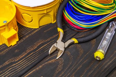 Electrical junction boxs with cables wire and tool used in the electric installation process