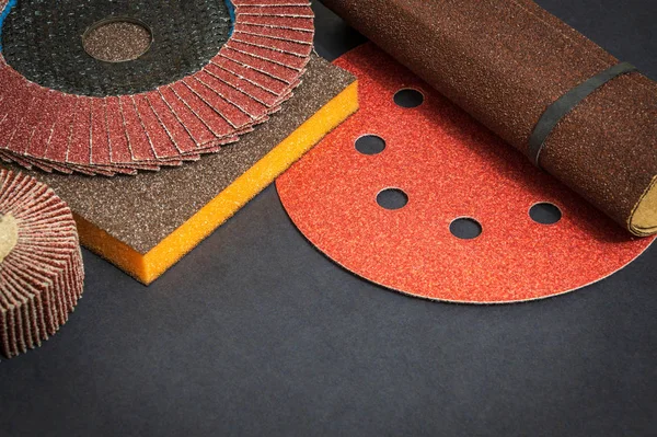 Big set of abrasive tools and multicolored sandpaper on black background — Stock Photo, Image