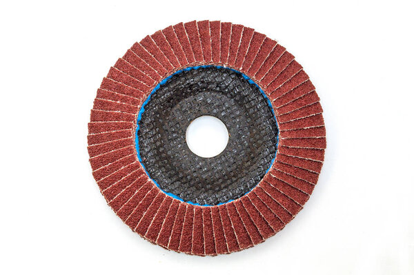 Abrasive tool or round brush for grinding building materials on white background