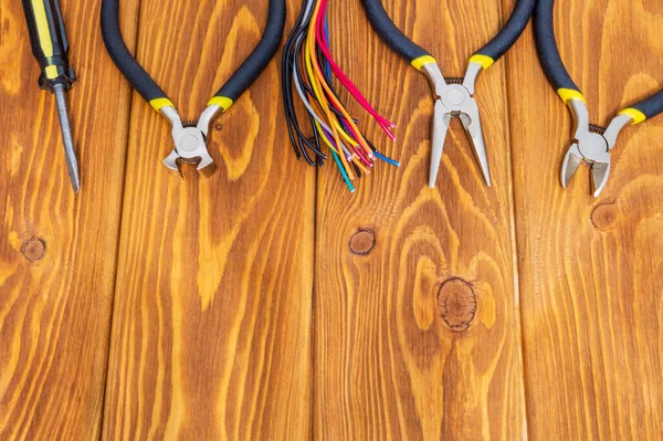 Power tools and cables on vintage wooden boards