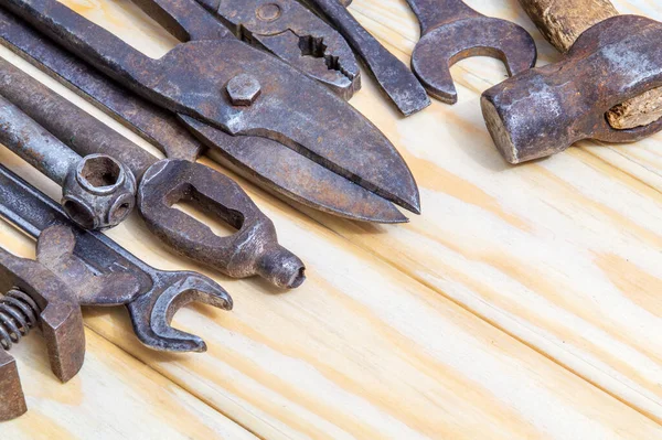 Vintage craftsman tools stacked after work on wooden boards — Stock Photo, Image