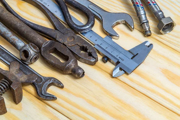 Many old tools stacked after work on wooden boards — Stock Photo, Image