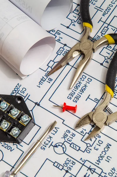 Electrical diagrams, accessories and metal pincers building house concept for engineering projects