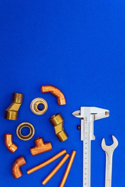 Set of tools for plumbing isolated on blue background with space for advertising