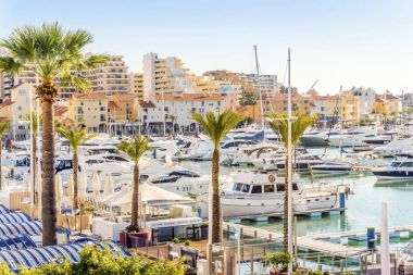 Marina full of luxurious yachts in touristic Vilamoura, Algarve, clipart