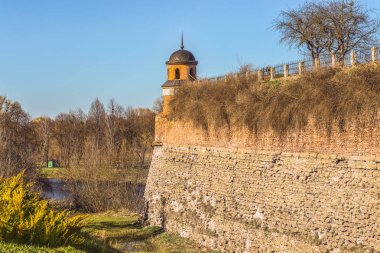 The watchtower and the moat in the ancient fortress of Dubno, Rivne region, Ukraine. clipart