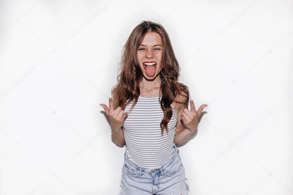 Isolated studio portrait of excited funny caucasian woman with red lips and long hair 