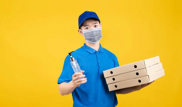 Delivery Handsome Man Wearing Mask Showing Hand Sanitizer Alcohol Gel — Stock Photo, Image