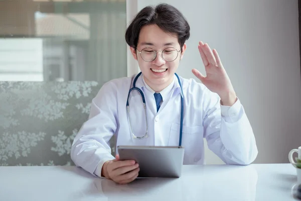 Asian doctor video conference with woman patient care discussing and consultant for medical coronavirus video call user interface healthcare online service remotely talking when quarantine at home.