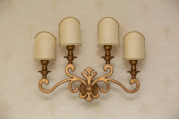 the lamp on the wall. sconces on three lamps