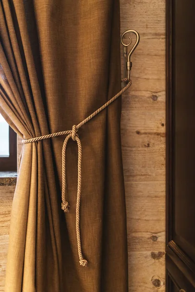 Holder for room curtains. Fragment photo curtain, interior detail, curtain detail close up,