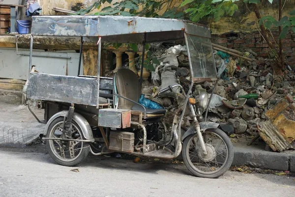 Funky vintage three wheel motorbike delivery truck on a street in rural Vietnam