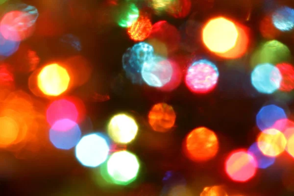 Blurred background from the lights of a colored Christmas garland.