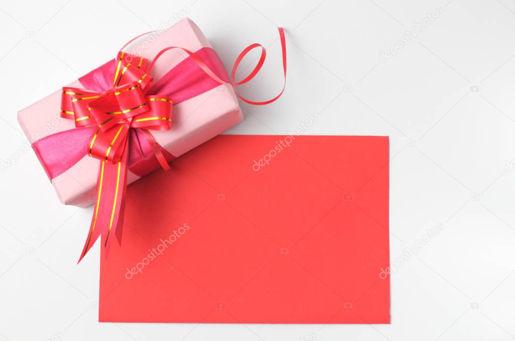 Blank field of greeting card or letter with a gift on a white background concept of festive congratulations.