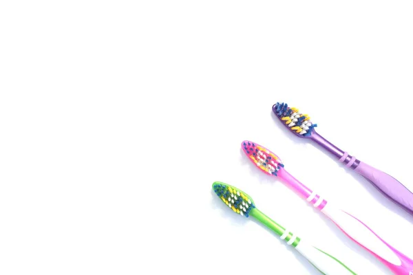 Flat lay, toothbrushes colored on a white background close-up , copy space. — Stock Photo, Image