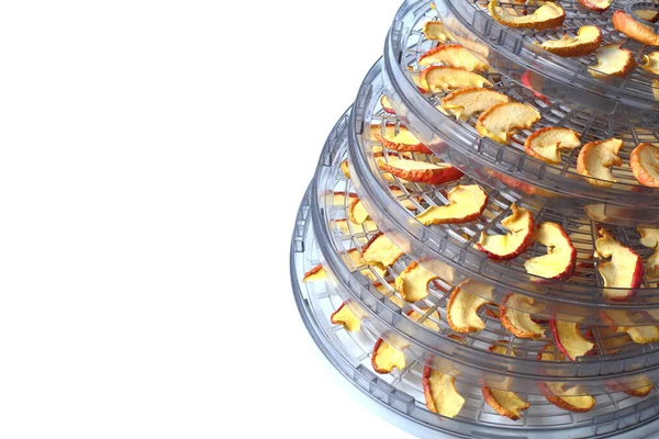 Drying sliced apples at home, white background, close-up.
