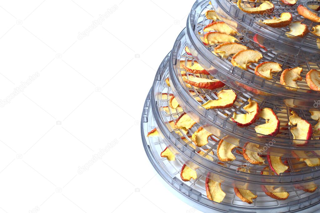 Drying sliced apples at home, white background, close-up.