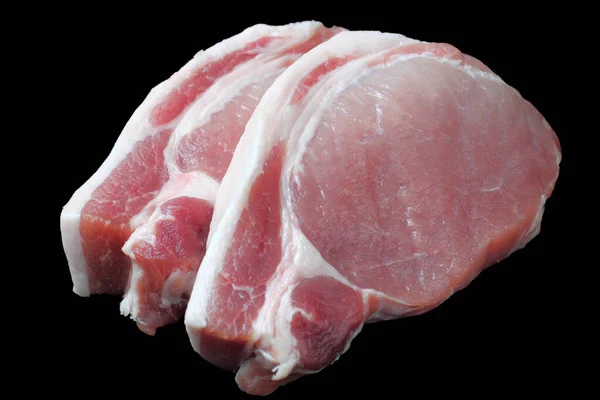 Grote Stukken Rauwe Varkenssteak Close Zwarte Achtergrond Isoleren — Stockfoto