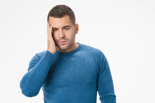 Caucasian unhealthy male suffer from strong headache and tired isolated on white studio background — 스톡 사진